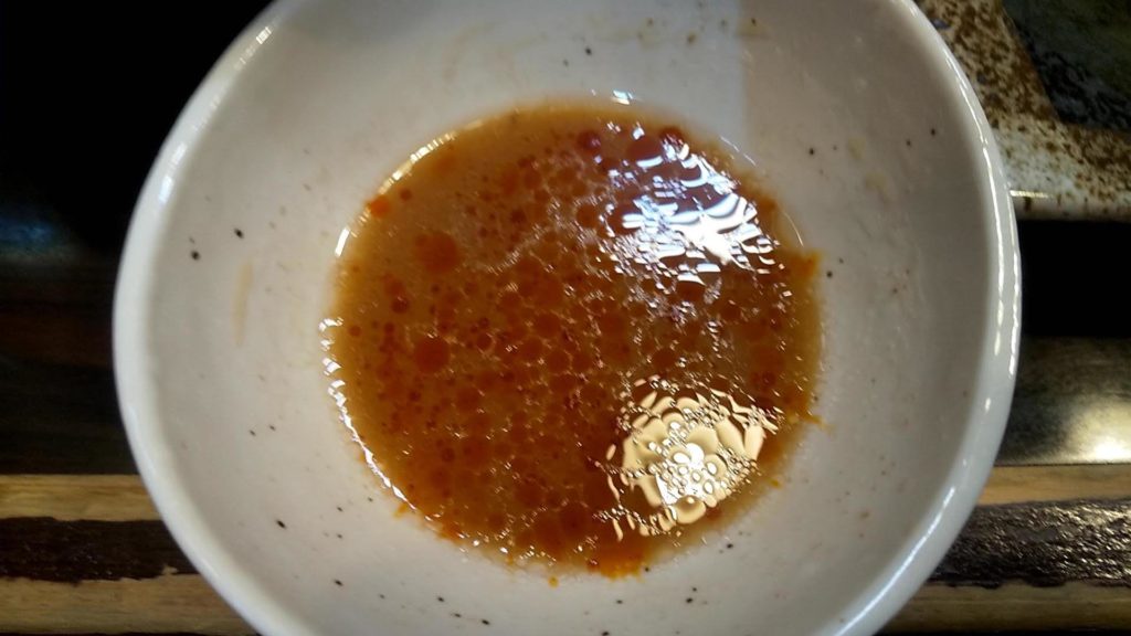 麺屋優創のつけ麺をラー油で味変した写真