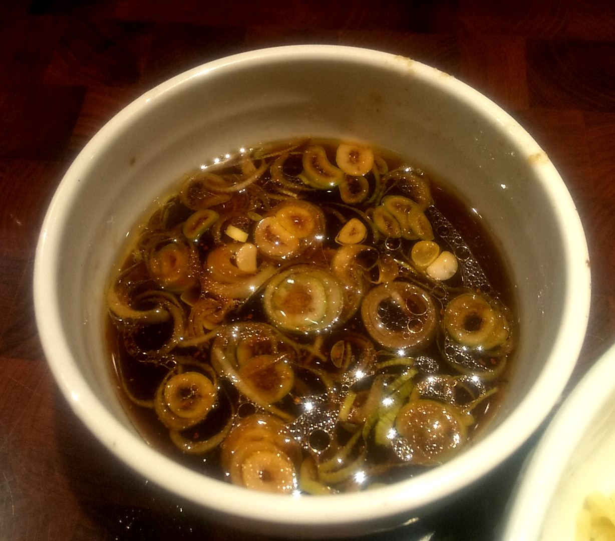 我武者羅の特製生姜醤油つけ麺のつけ汁の写真